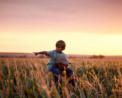 A Child On His Father's Shoulders